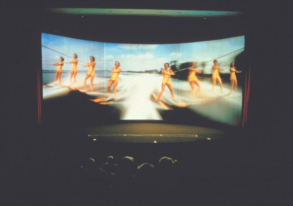 An image of Pictureville Cinema, Bradford, with an audience watching a scene from This is Cinerama
