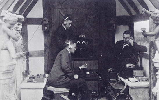 All the paraphernalia of the BBC: wireless engineers take up station outside the front door of Foyle Riding. A G D West is in the foreground, P P Eckersley at right. (Copyright unknown)