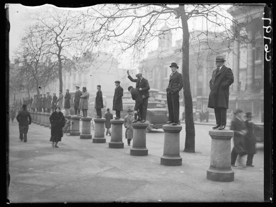 Men standing on bollards to watch a demonstration, 4 March 1934, Edward George Malindine, Daily Herald Archive, National Media Museum Collection / SSPL