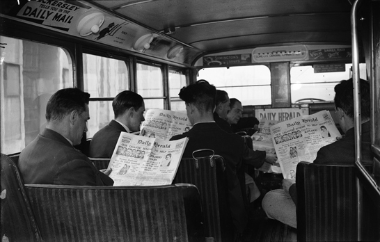 Bus passengers reading the Daily Herald newspaper, George Woodbine, Daily Herald Archive, National Media Museum