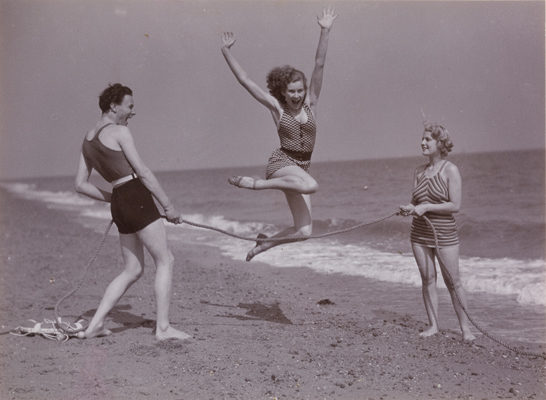 Woman leaps over rope on beach, c.1935, National Media Museum Collection