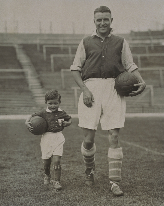 Arsenal FC in training, 1934 © Daily Herald / National Media Museum, Bradford / SSPL A photograph of England and Arsenal Captain Eddie Hapgood (1908 - 1973) and his son as the Arsenal mascot, at Highbury, London.
