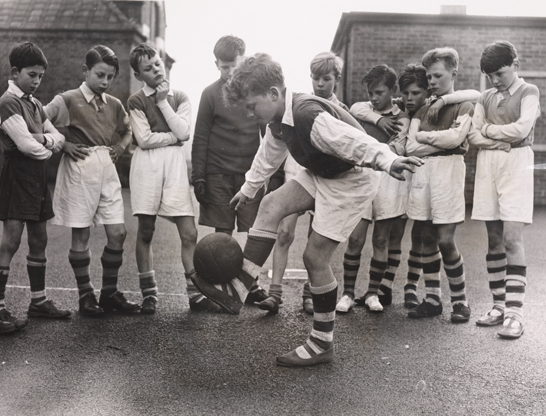 Skillful footwork at after-school football training, 1957, National Media Museum, Bradford / SSPL © Daily Herald / Fox Photos 