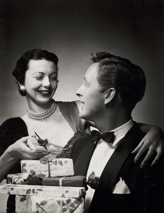 Couple with Christmas presents, c. 1958, Photographic Advertising Limited © National Media Museum, Bradford / SSPL. Creative Commons BY-NC-SA