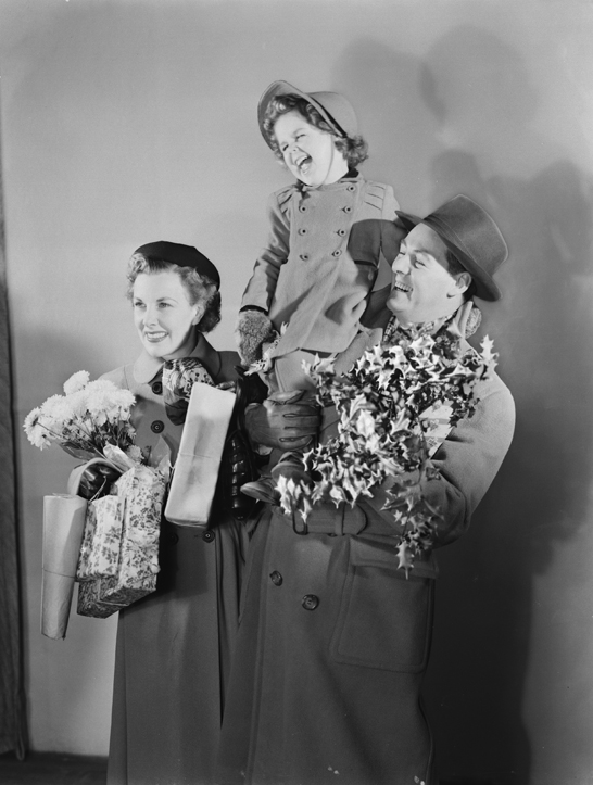 Family carrying Christmas presents, 1950, Photographic Advertising Limited © National Media Museum, Bradford / SSPL. Creative Commons BY-NC-SA