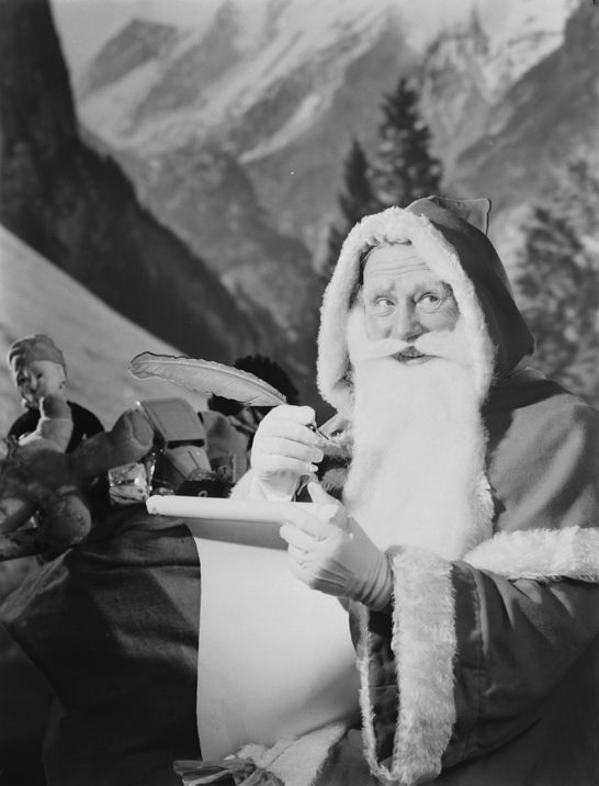 Father Christmas checking his list, 1950, Photographic Advertising Limited © National Media Museum, Bradford / SSPL. Creative Commons BY-NC-SA