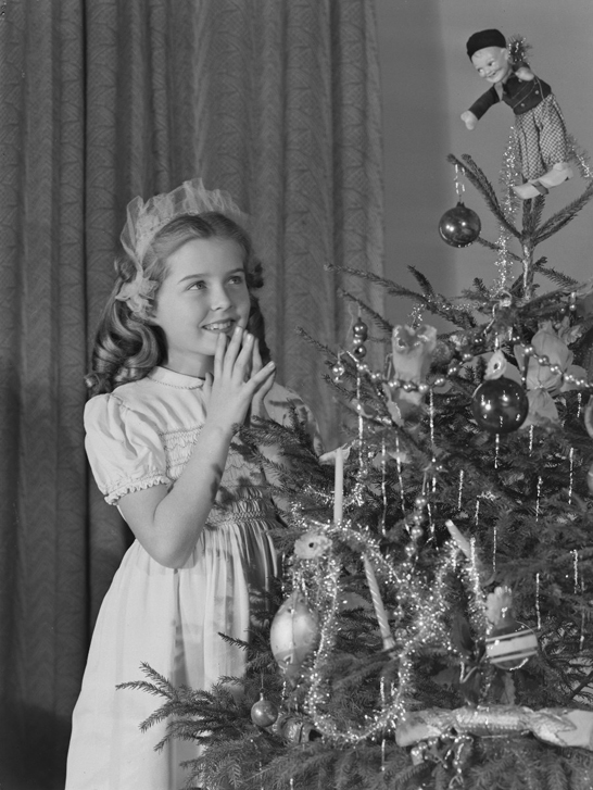 Little girl looking at Christmas tree, c. 1950, Photographic Advertising Limited © National Media Museum, Bradford / SSPL. Creative Commons BY-NC-SA