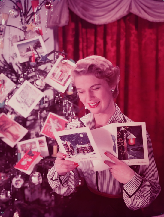 Woman reading Christmas cards, c.1950, Photographic Advertising Limited © National Media Museum, Bradford / SSPL. Creative Commons BY-NC-SA