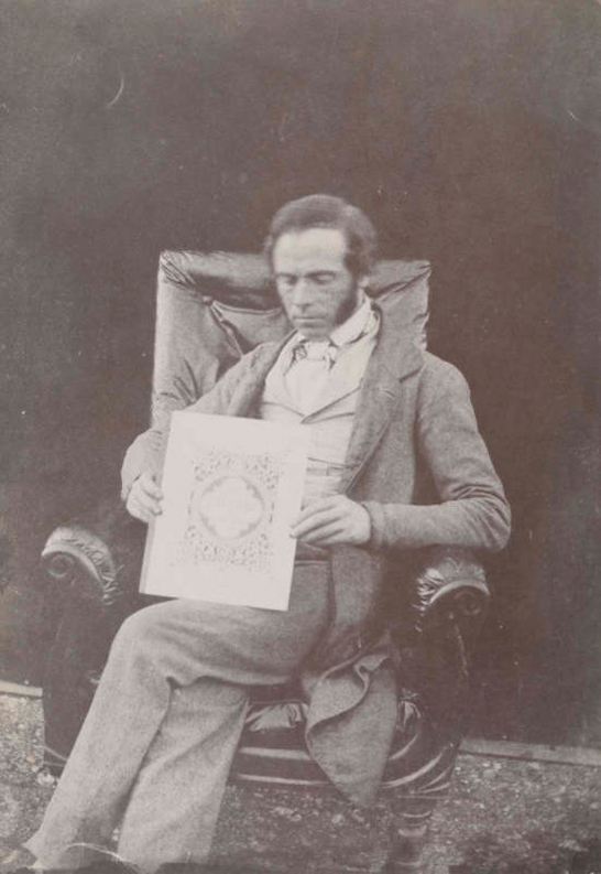 Nicolass Henneman holding a copy of The Pencil of Nature, 1844, William Henry Fox Talbot © National Media Museum, Bradford / SSPL. Creative Commons BY-NC-SA
