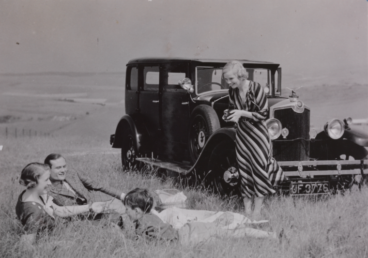 Family with car and picnic