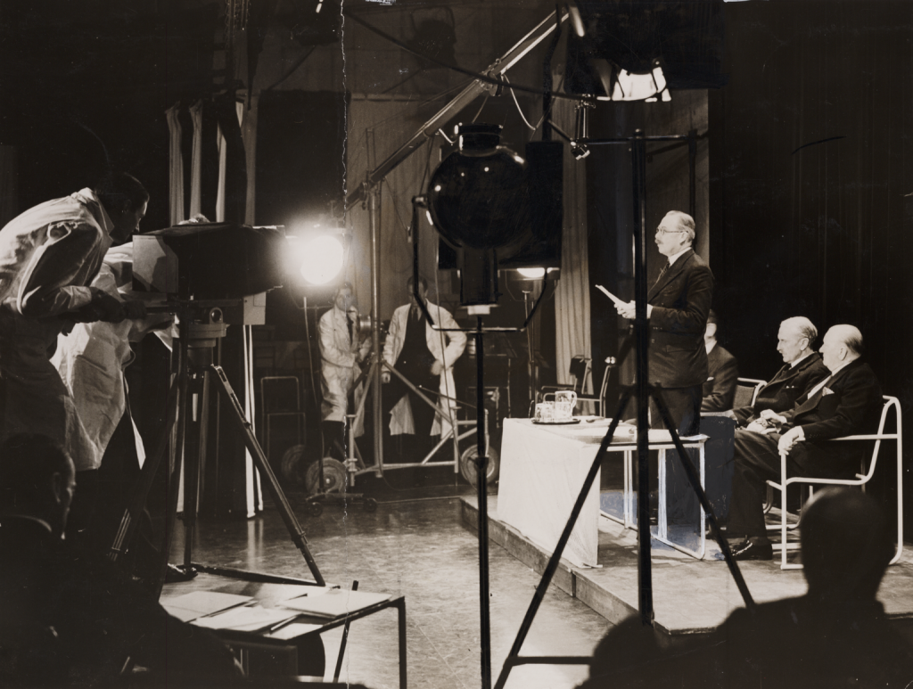 The Postmaster-General, Major G C Tyron addresses the Baird studio cameras, 2 November 1936