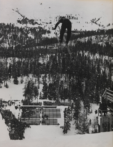 A ski jumper flying through the air