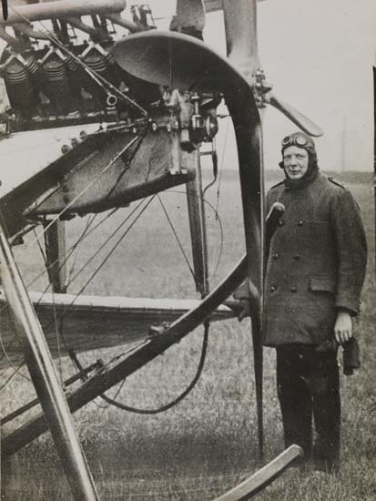 Winston stood next to an aeroplane, 1914