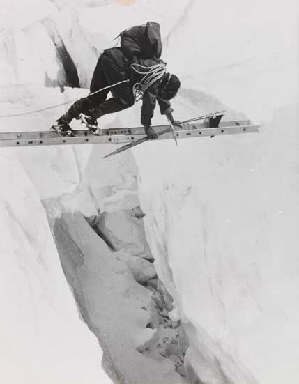 Crossing a crevasse on a ladder