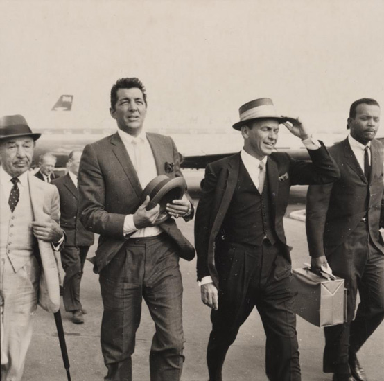 Photograph of Frank Sinatra on his arrival at the airport