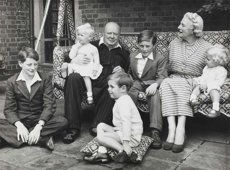 The Churchill Family sat in a garden