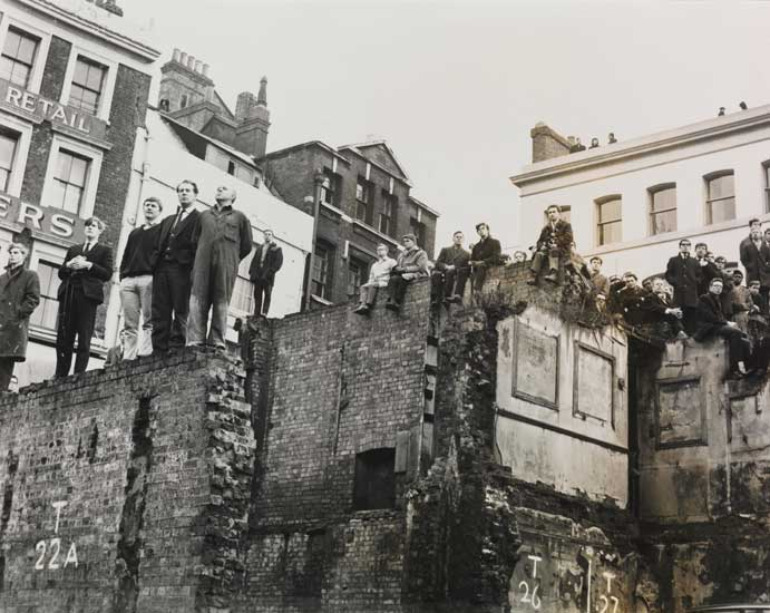 Crowds of people stood on the tops of houses, observing Churchill's funeral