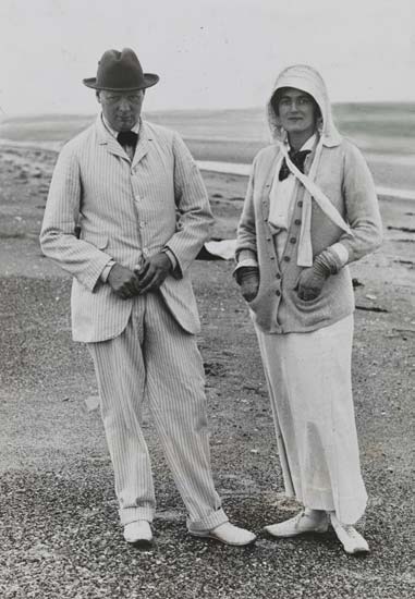 Churchill and his wife stood on a beach