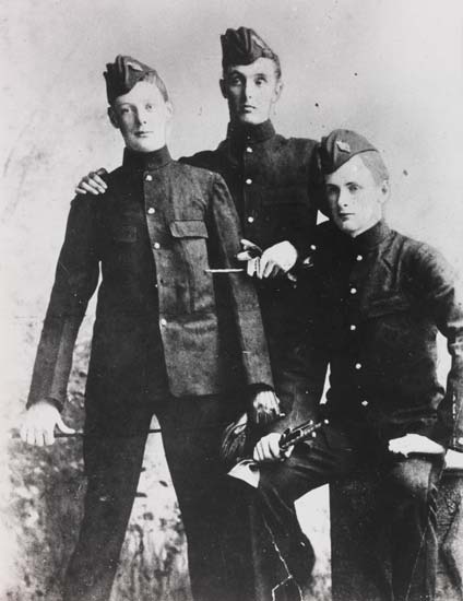Churchill as a young man with two other young men, all in soldier uniform