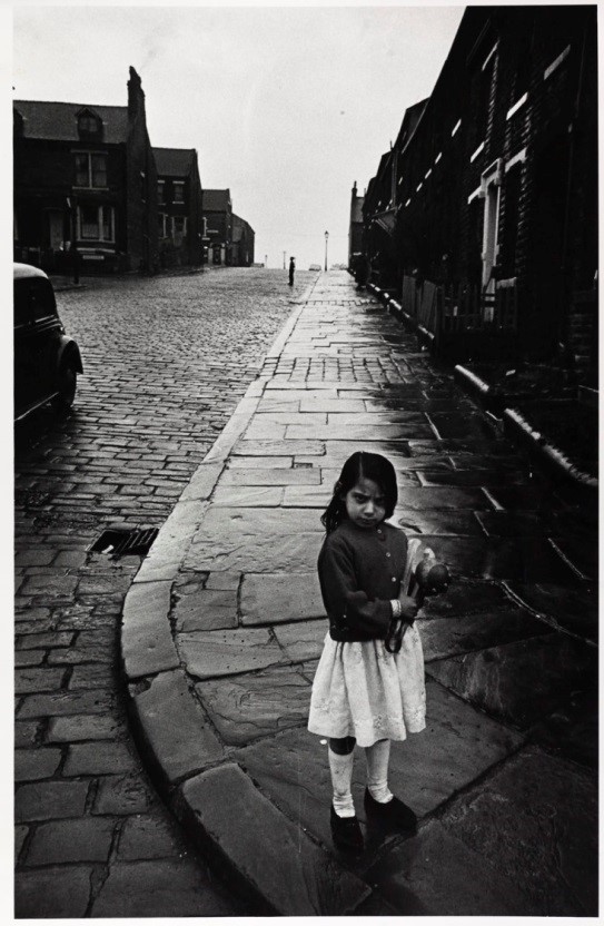Bradford May 1969 Child with washing tongs and ball by Nick Hedges