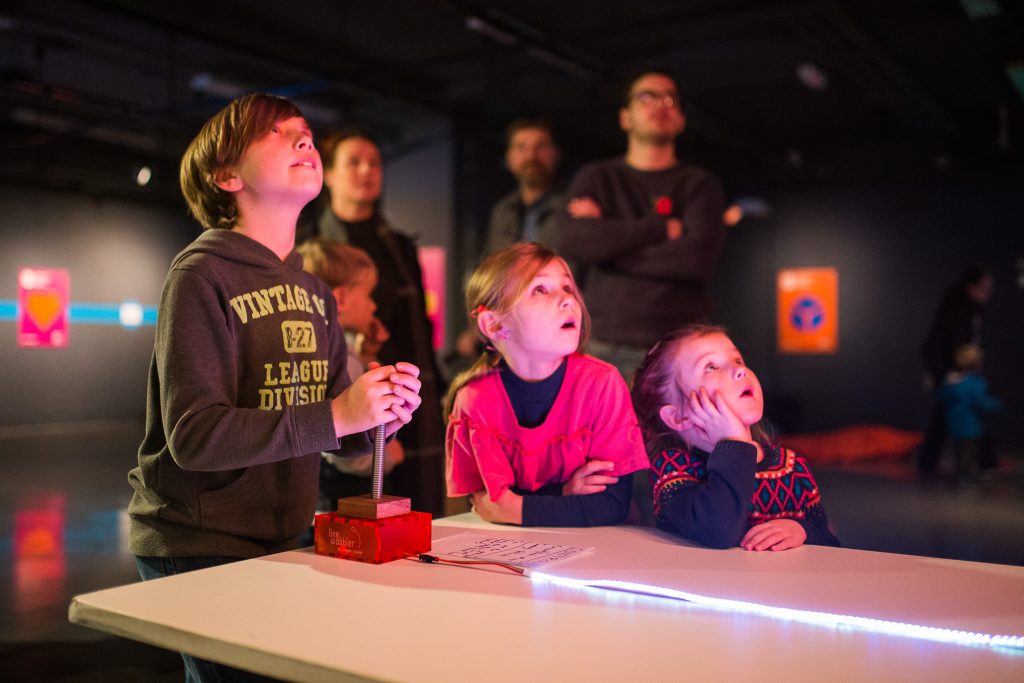 Young visitors test out unusual games as part of Videogames, But... in Gallery One