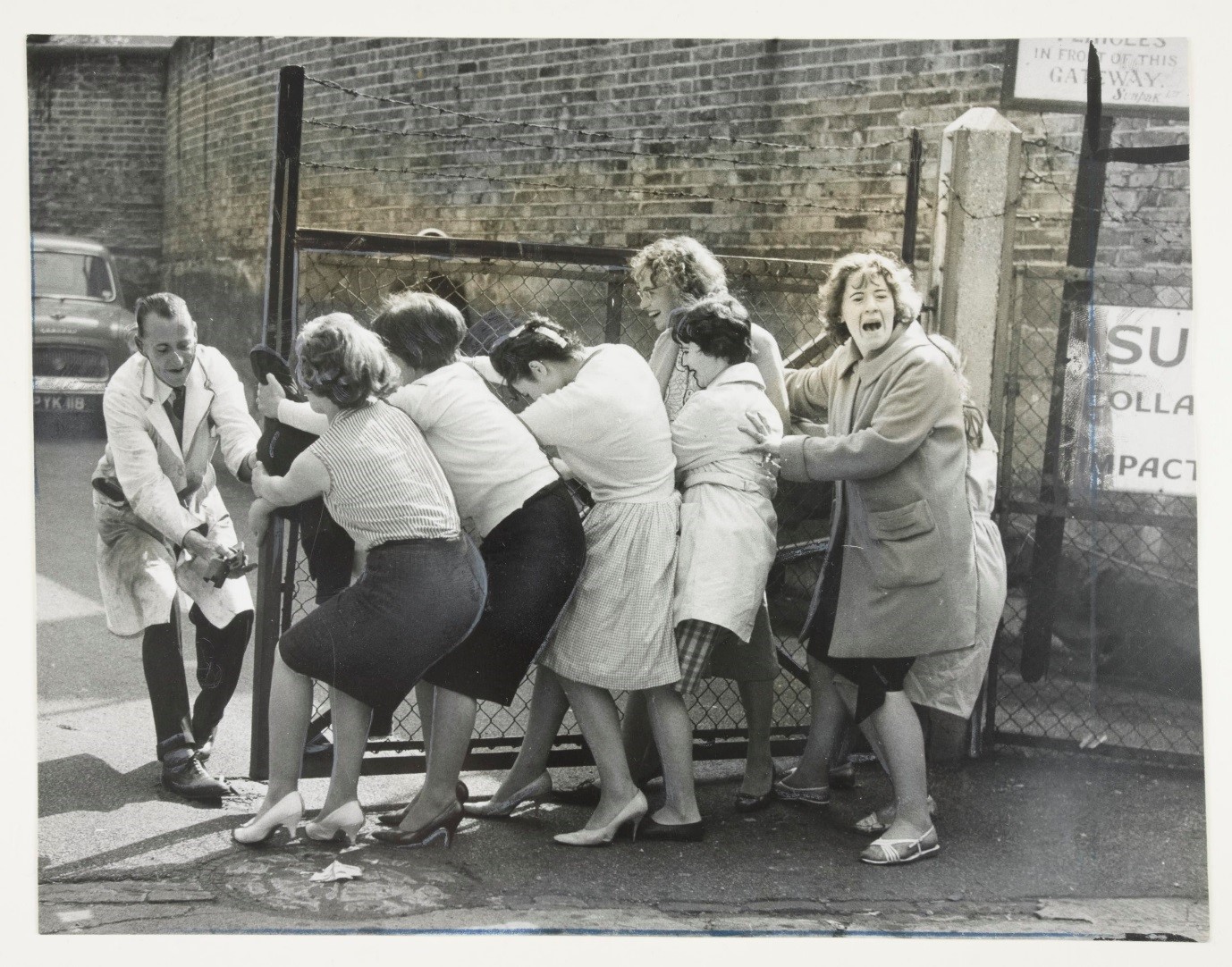 Photograph of seven women workers on strike at Sunpak Ltd metal manufacturers in Kennington, London on 8th September 1960