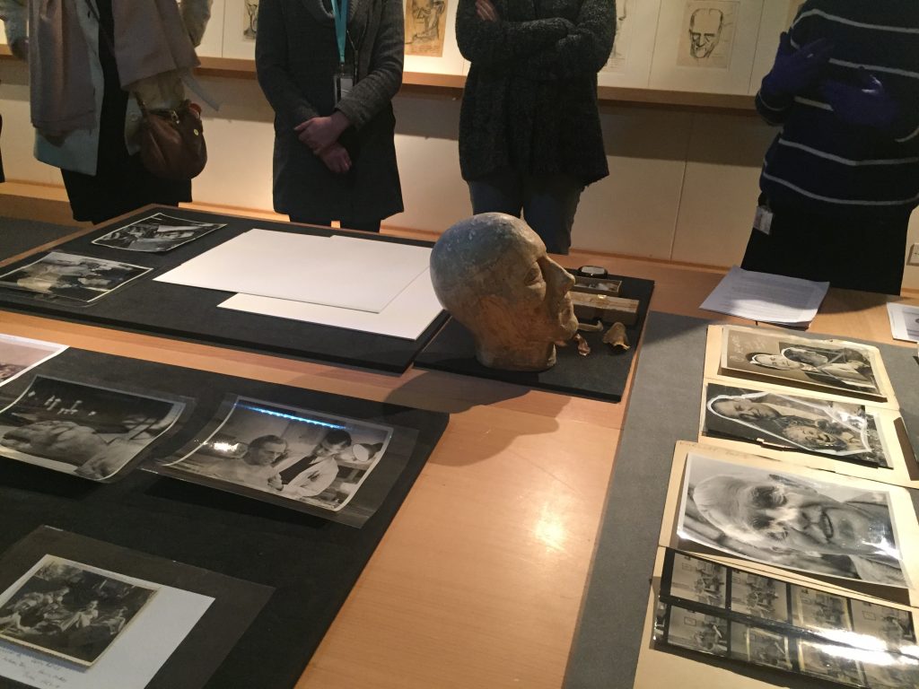 Visitors inspect items from the Hammer collection in Insight: Collections & Research Centre
