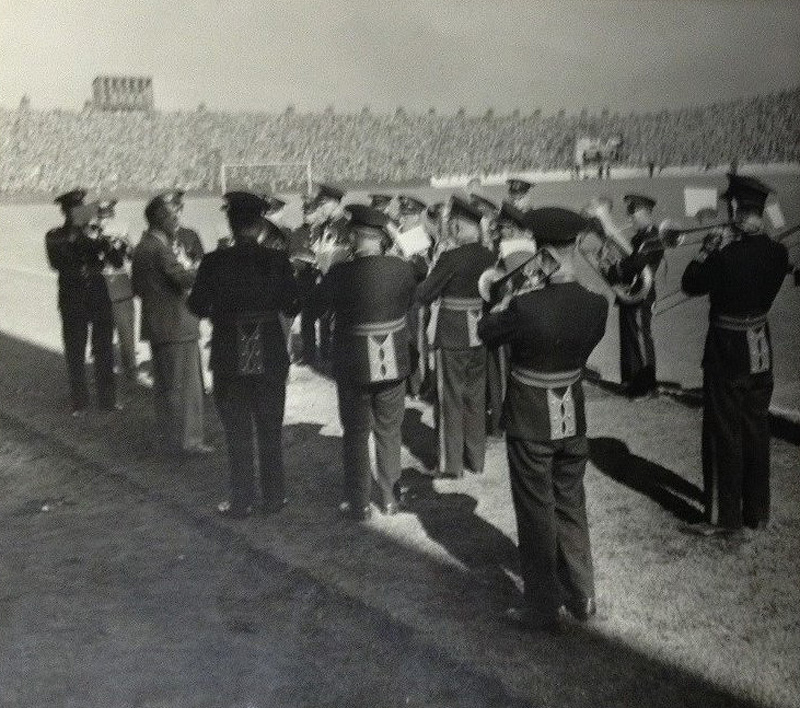 Photograph showing a Lancashire brass band playing at a football match in 1952