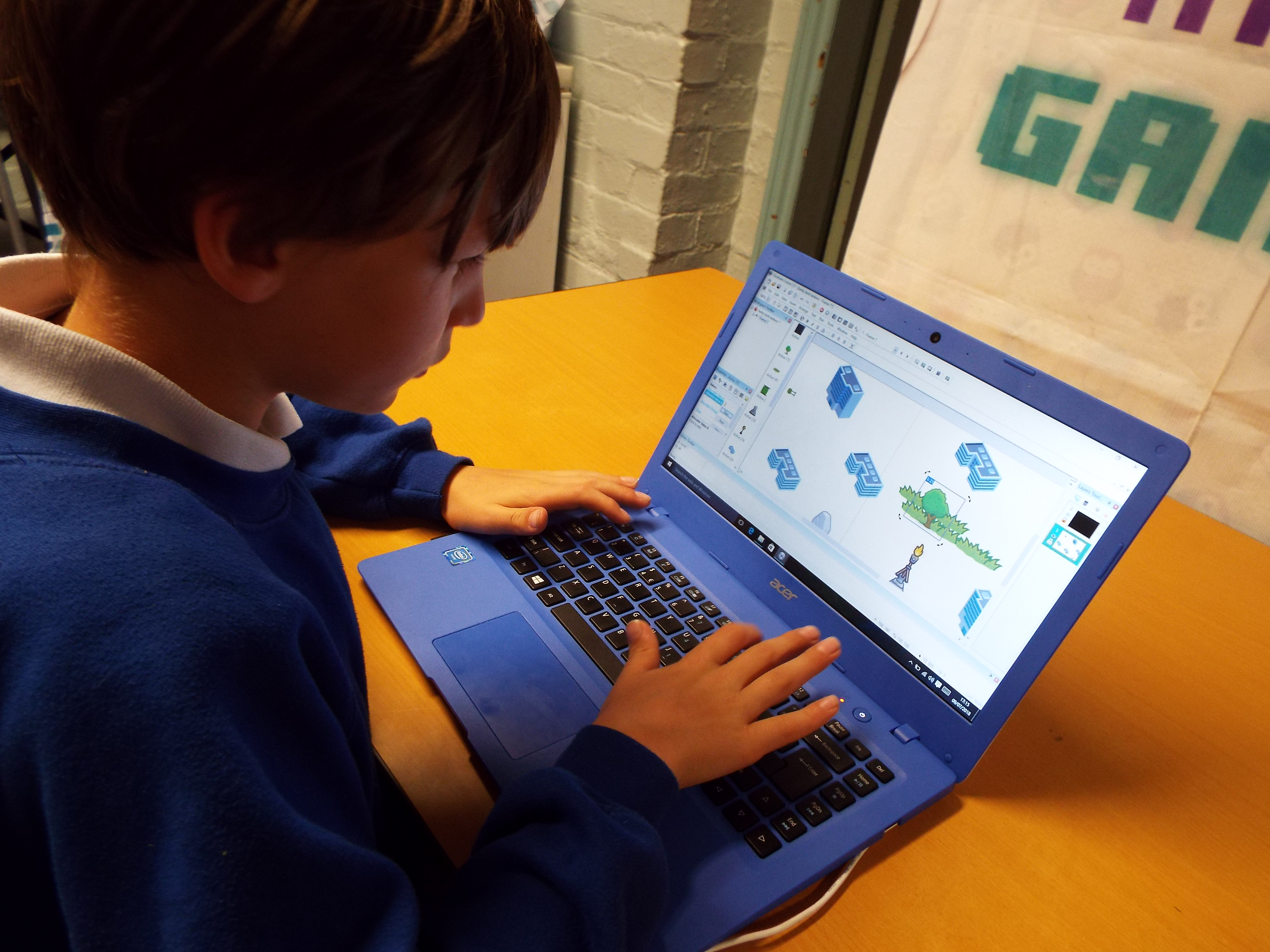 A boy coding a game as part of an Impact Gamers workshop