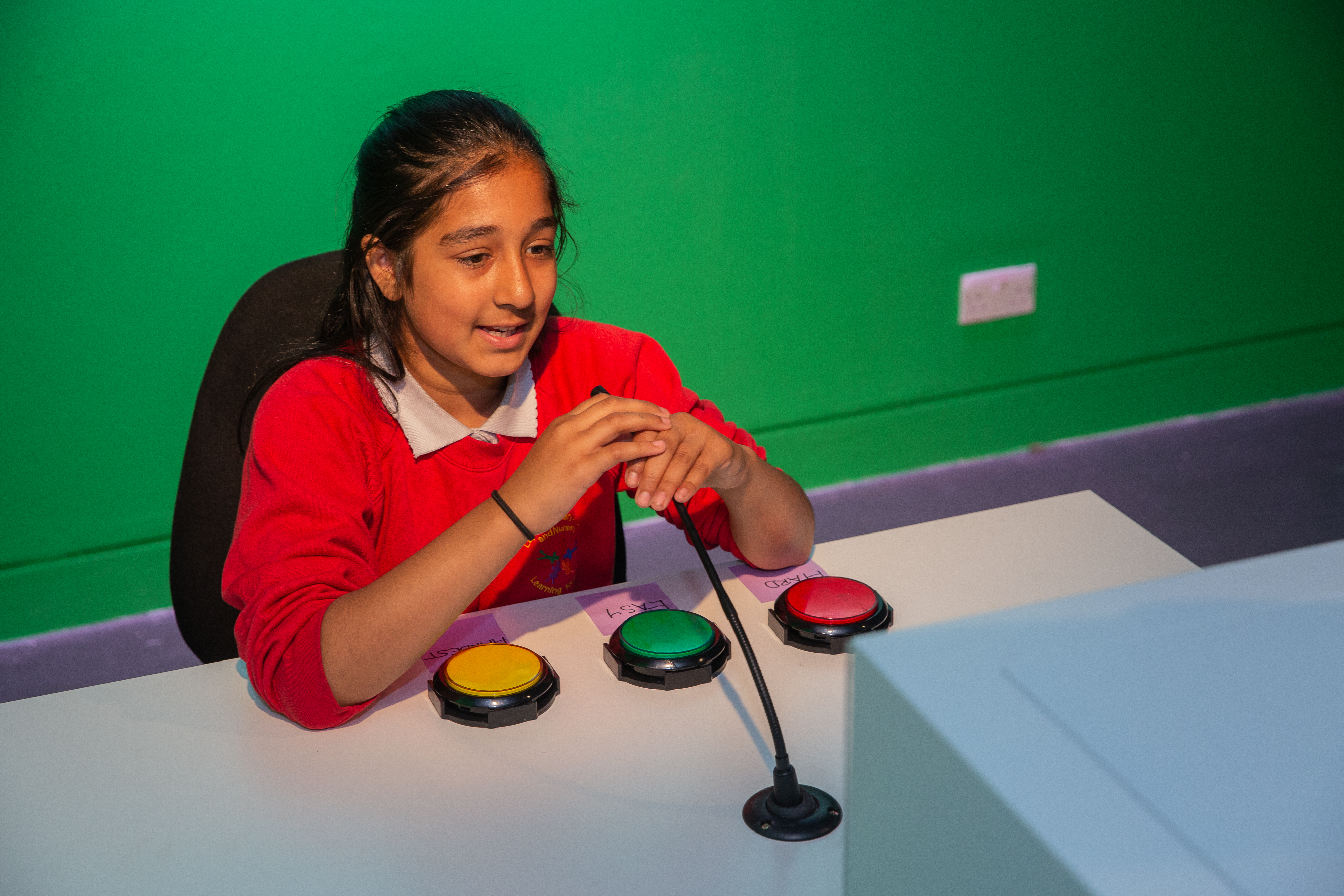 A student tries out 'Be a Presenter' at the Action Replay exhibition