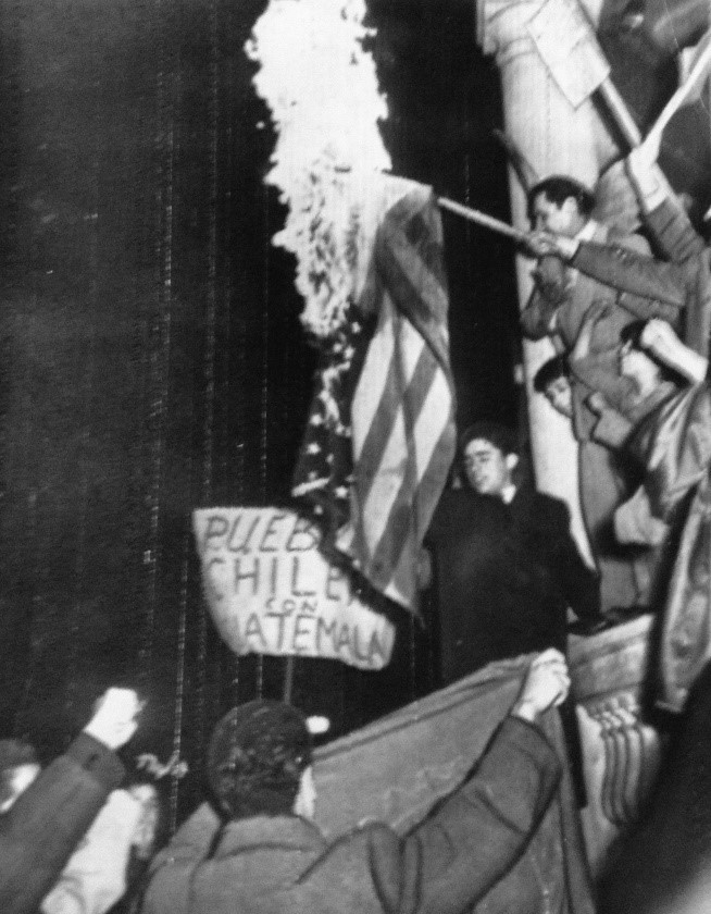Photograph showing the burning of the American flag during a demonstration in Chile