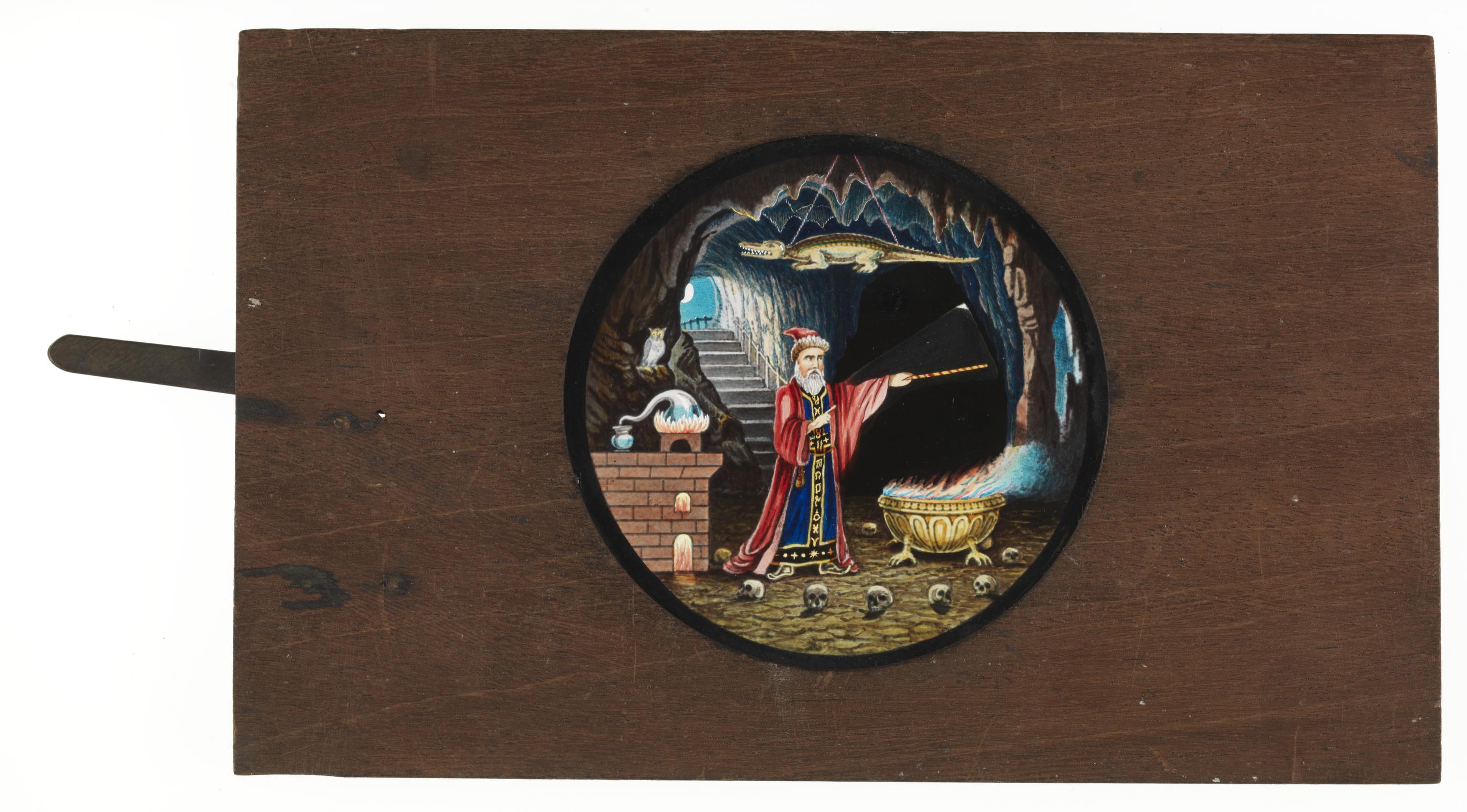 Magic lantern lever slide depicting a wizard