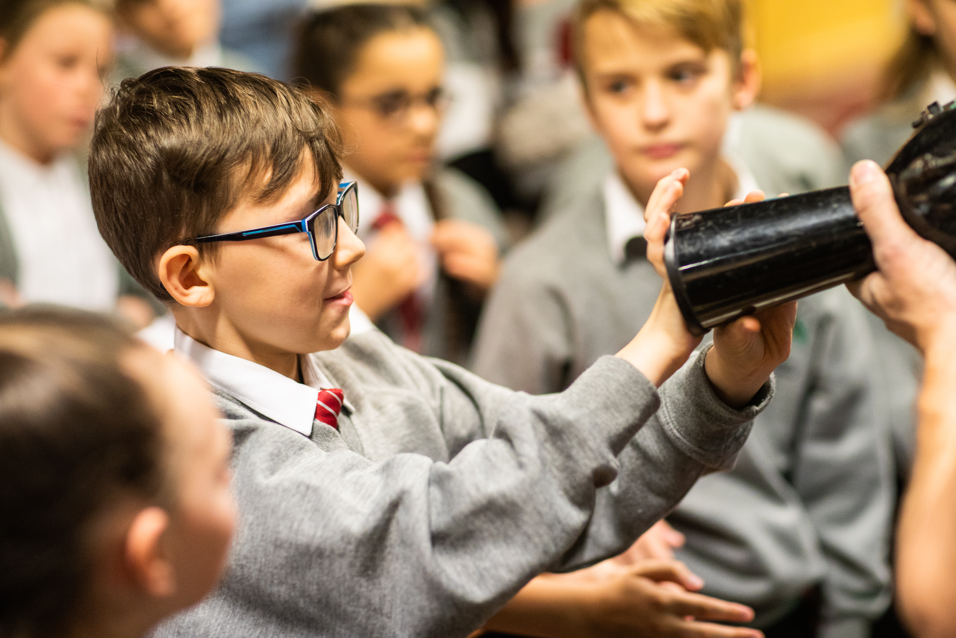 Schoolchildren take part in a physics activity