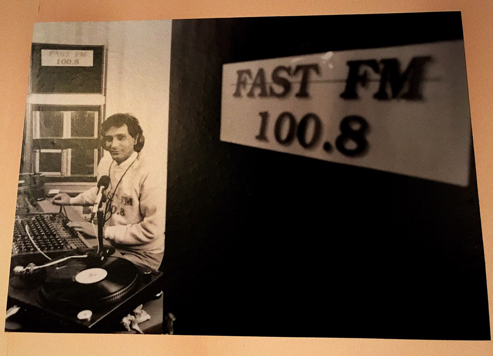 Black-and-white photograph of the Fast FM 100.8 studio