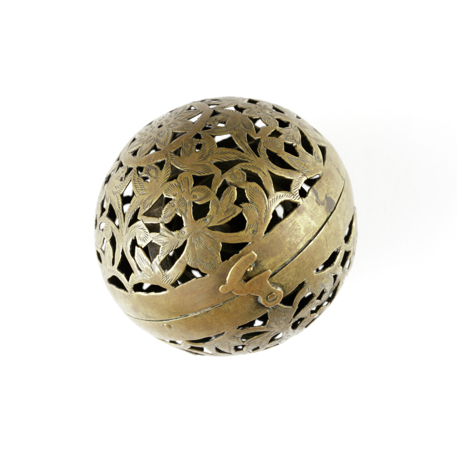 Intricately carved gold metal ball