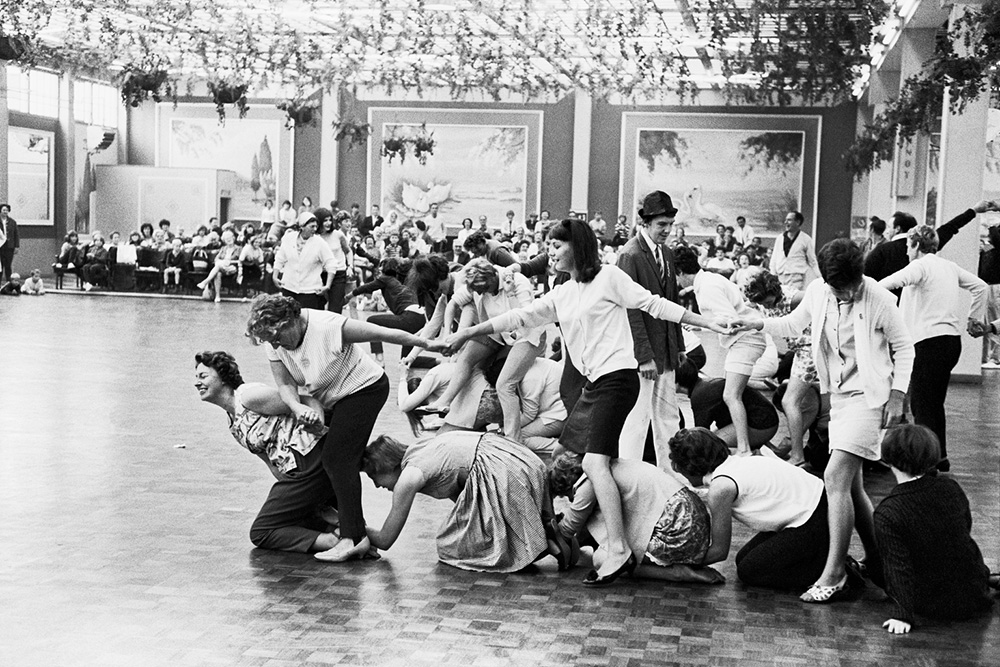 Large group of people dancing in a hall