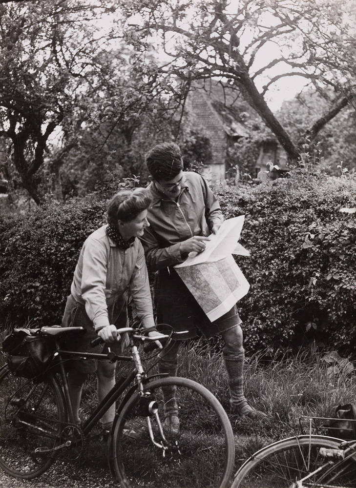 Two cyclists studying a map
