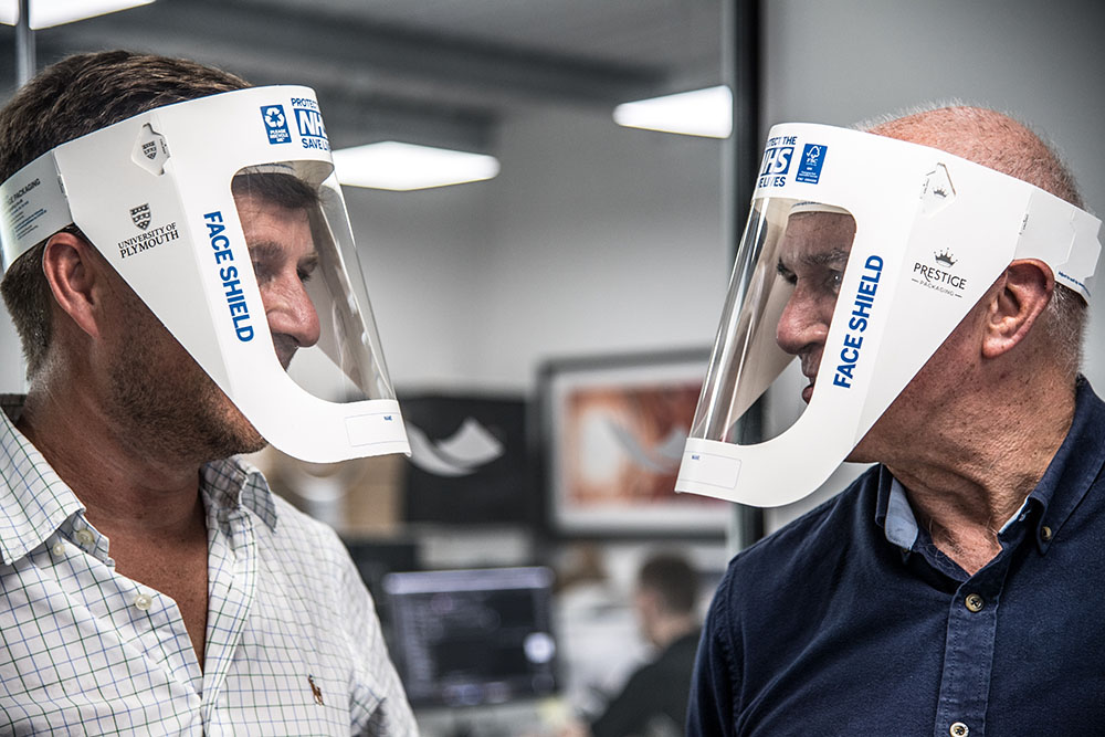 Dr Antony Robotham and colleague model face shields