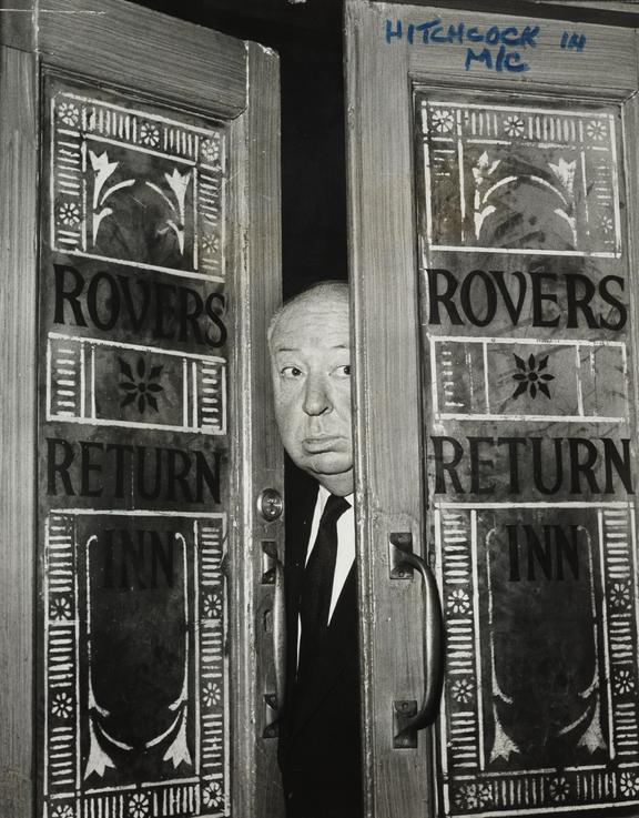 Alfred Hitchcock at the doors of Coronation Street's Rovers Return