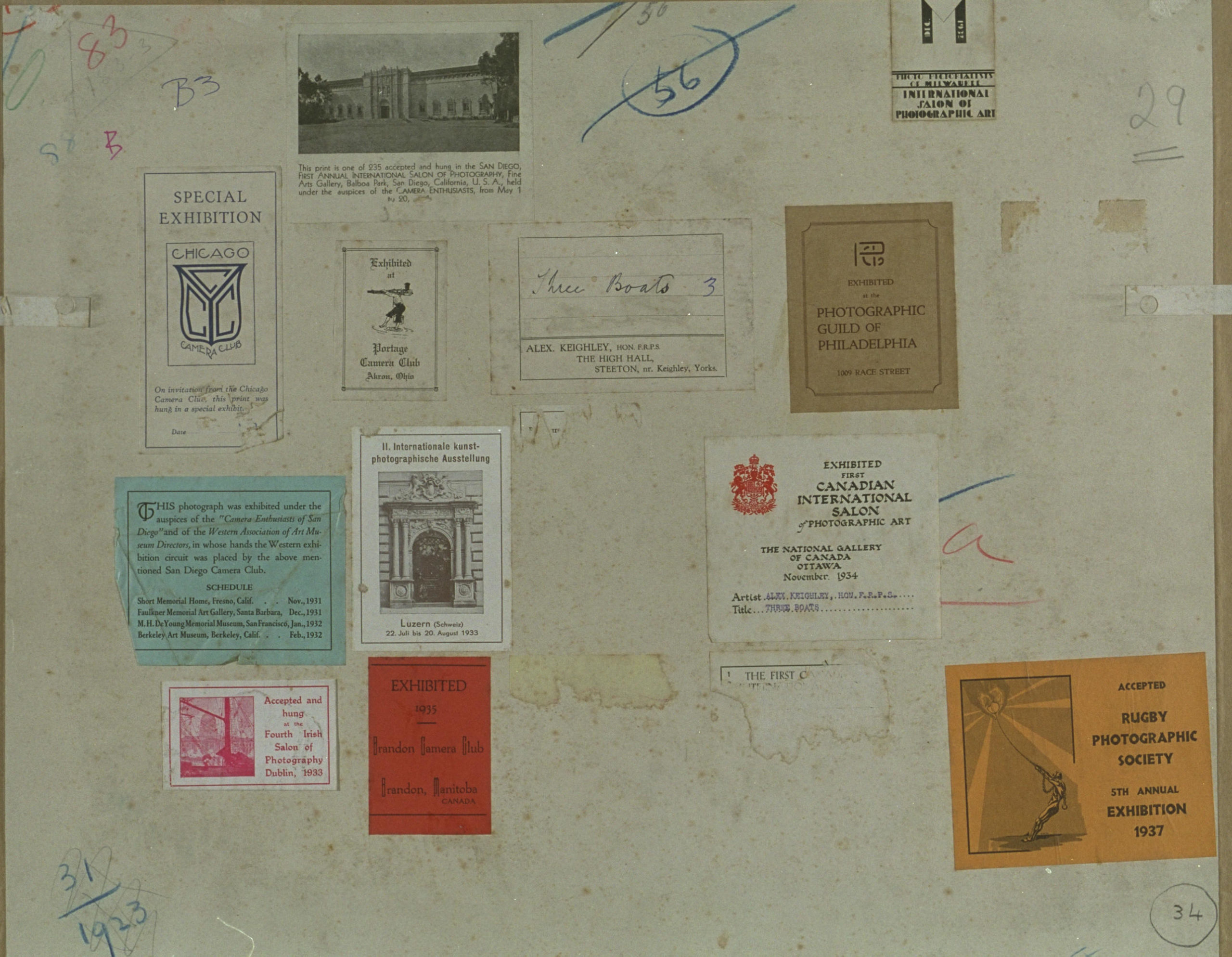 Reverse of photograph with stamps from a variety of competitions
