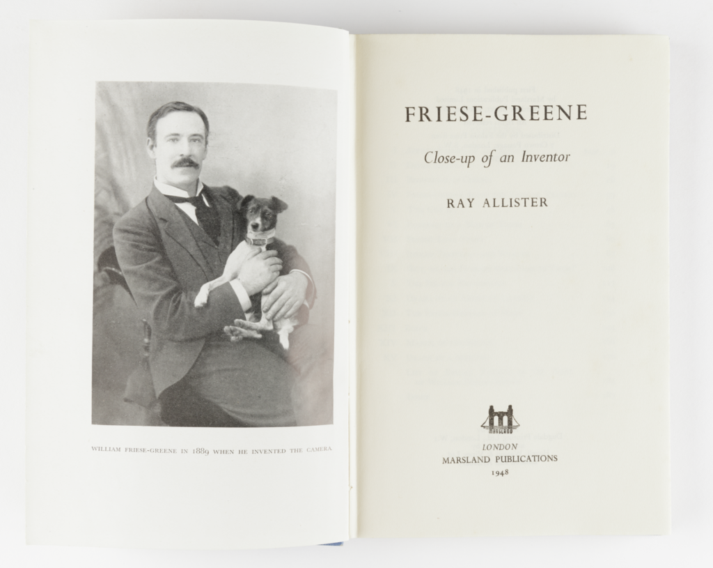 Frontispiece of a book with a photo of Friese-Greene holding a dog