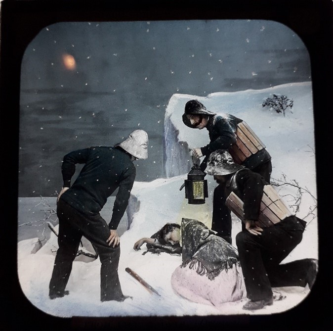 Lantern slide showing three rescuers trying to revive a woman who has collapsed in the snow