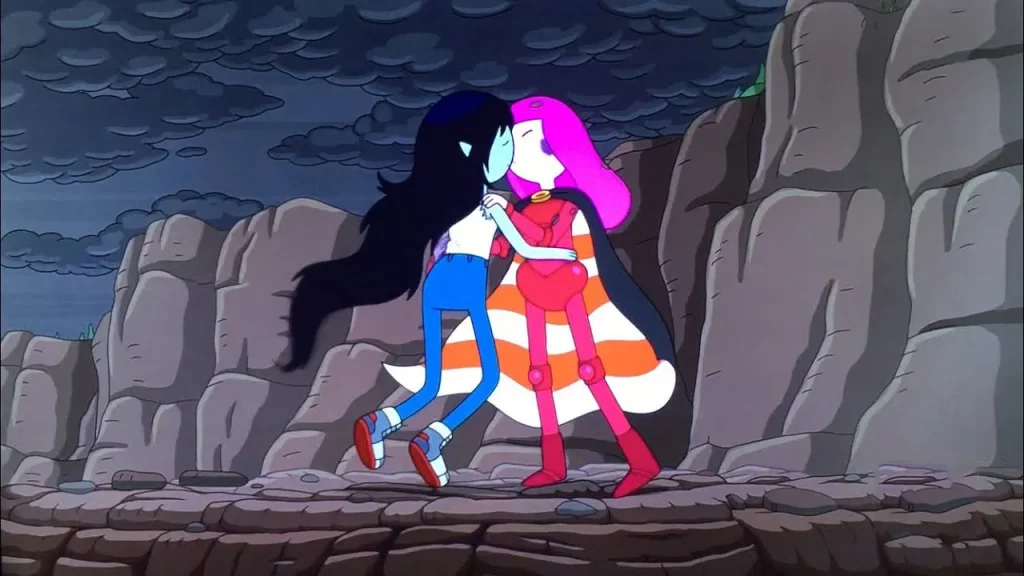 Two animated characters in colourful outfits embrace, with rocky cliffs behind