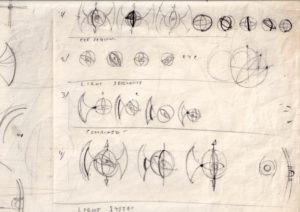 A creased piece of paper covered in sketches of a spherical design