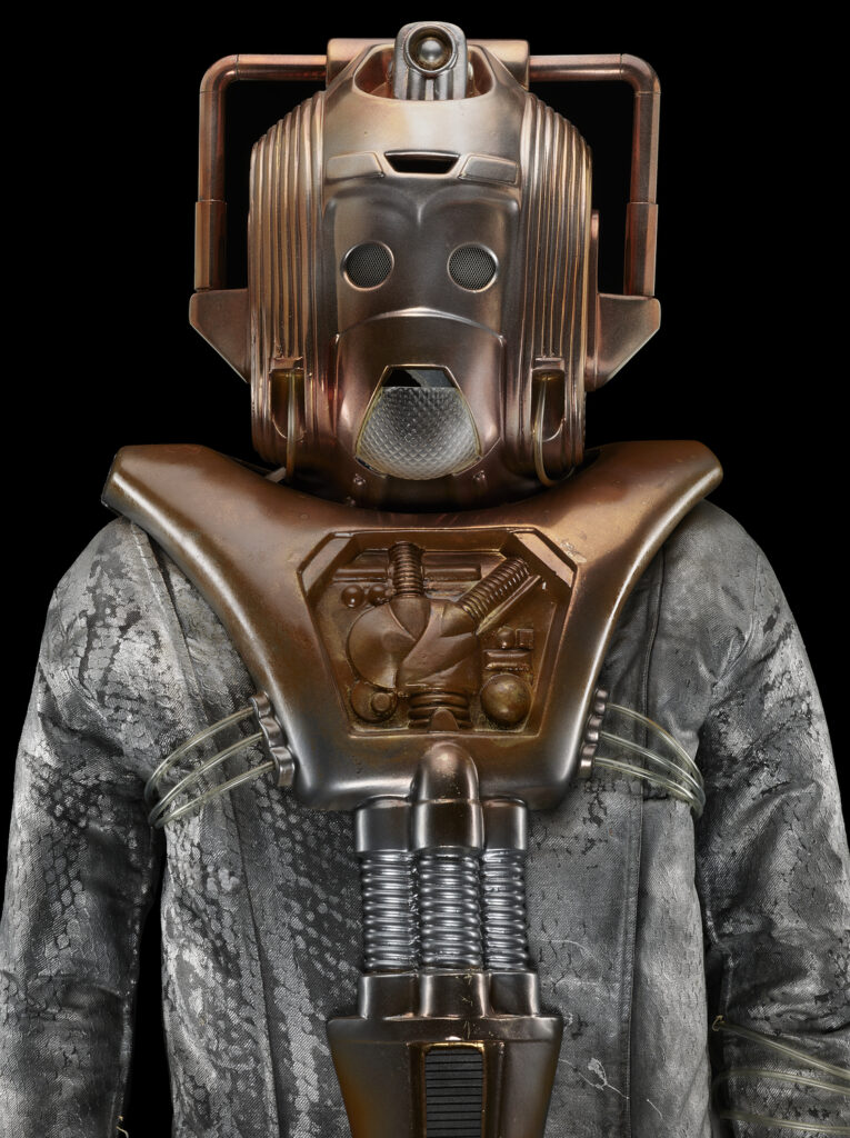 A costume with a robotic metal head and silver body