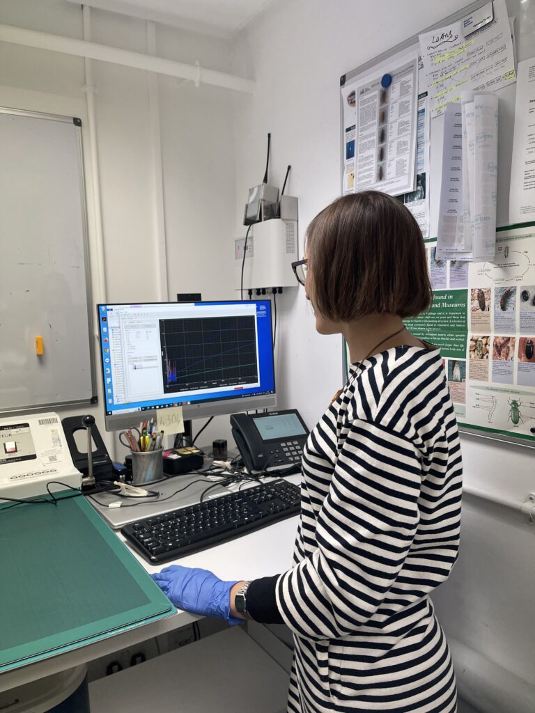 Vanessa looks at a computer screen showing light sensitivity information