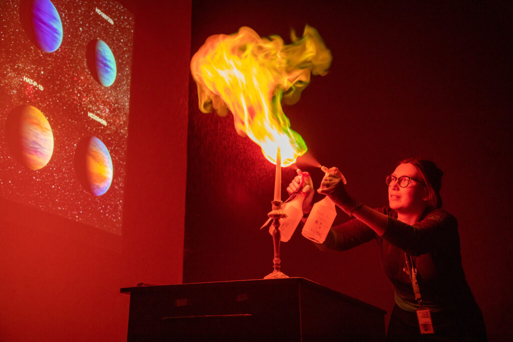 Explainers demonstrating with fire during a Space Show