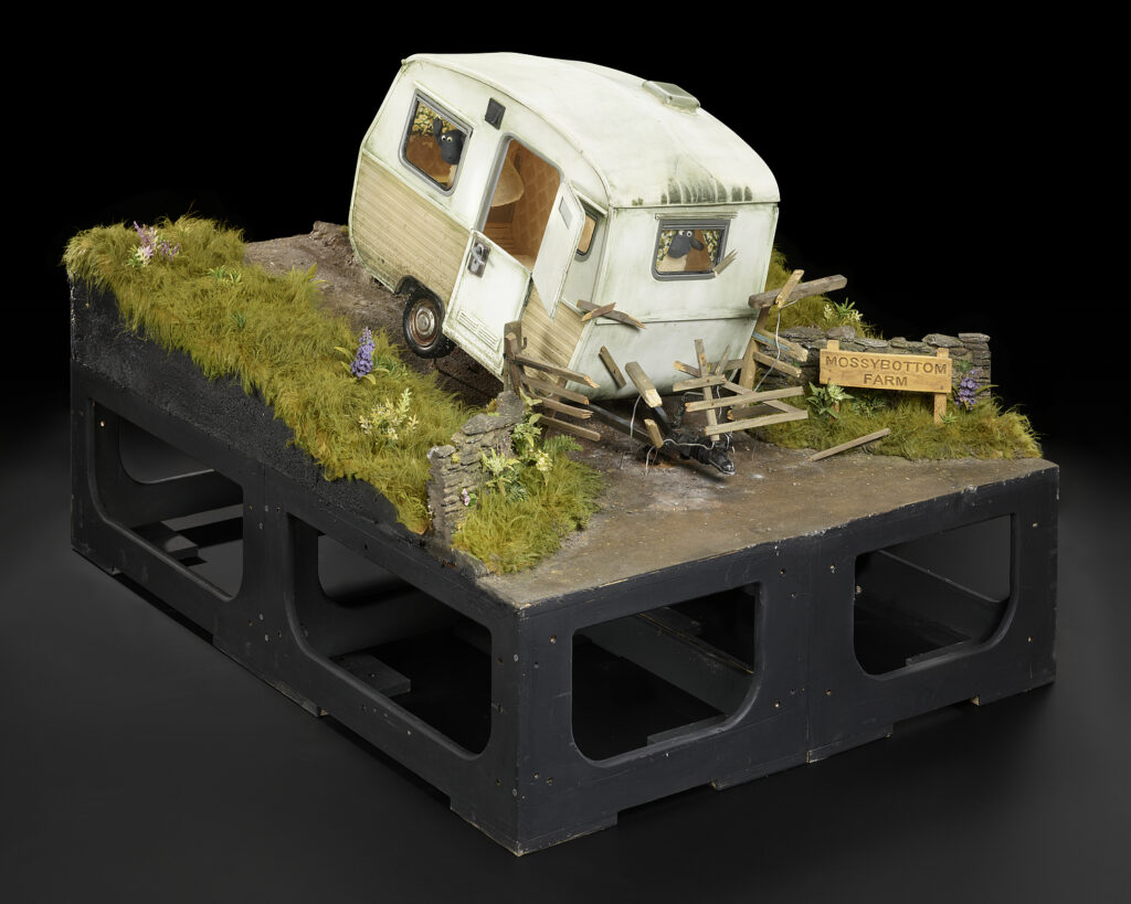 Animation model of a caravan crashing through a garden fence