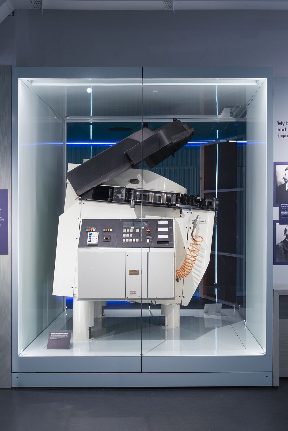 Large IMAX projector in a glass case in Sound and Vision
