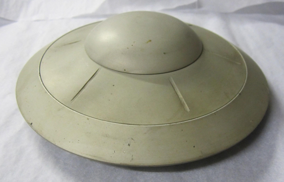 An original model of a flying saucer from Earth vs. the Flying Saucers © The Ray and Diana Harryhausen Foundation